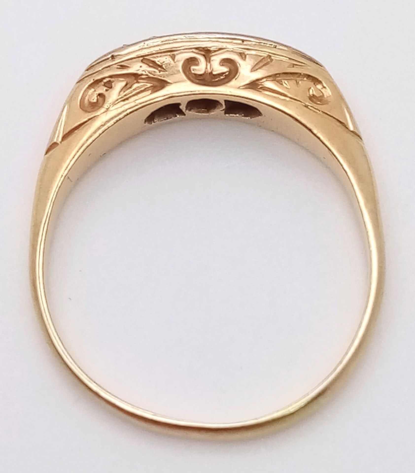 An antique yellow gold (tests 18 K) ring with a band of five old cut diamonds resting on a hand- - Image 4 of 8