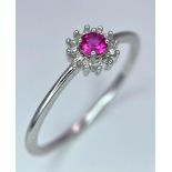 A 9K White Gold, Red Stone and Diamond Cluster Ring. Size N. 1.1g