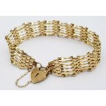 A Vintage 9K Yellow Gold Gate Bracelet with Heart Clasp. 16cm. 6.82g weight.
