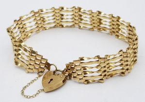 A Vintage 9K Yellow Gold Gate Bracelet with Heart Clasp. 16cm. 6.82g weight.