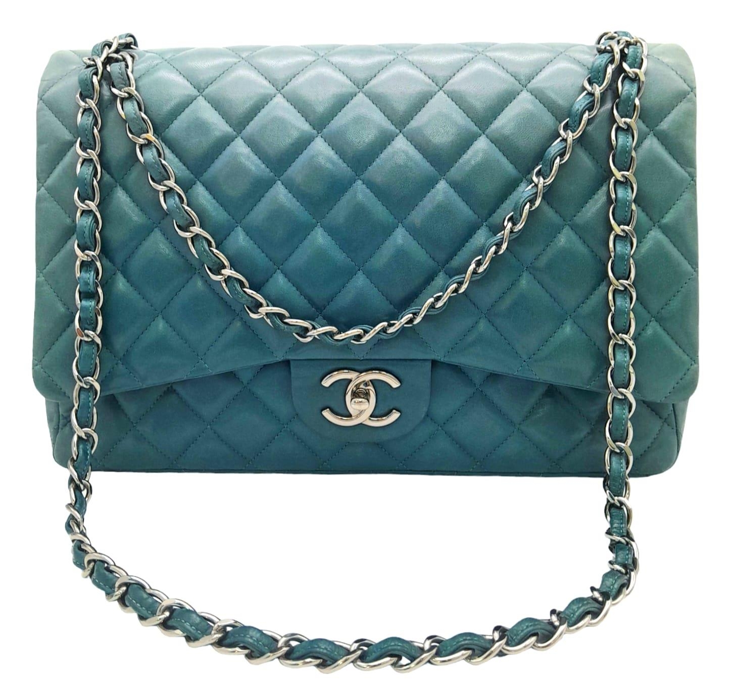 A Chanel Teal Jumbo Classic Double Flap Bag. Quilted leather exterior with silver-toned hardware,