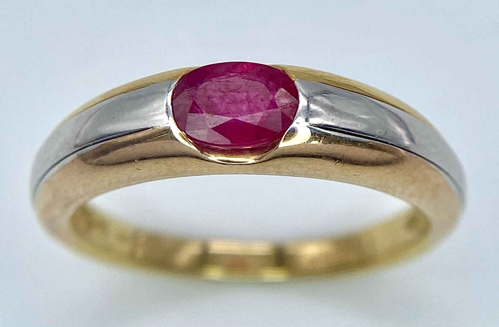 A 9K Yellow Gold Ruby Ring. Oval central ruby. Size N. 2.85g total weight. - Image 3 of 8