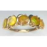 A VERY ATTRACTIVE 5 GEMSTONE RING IN 9K GOLD . 2.8gms size O