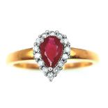 AN 18K YELLOW GOLD DIAMOND & RUBY PEAR SHAPE RING. 0.50CT PEAR SHAPED RUBY WITH DIAMOND SURROUND.