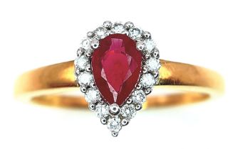 AN 18K YELLOW GOLD DIAMOND & RUBY PEAR SHAPE RING. 0.50CT PEAR SHAPED RUBY WITH DIAMOND SURROUND.