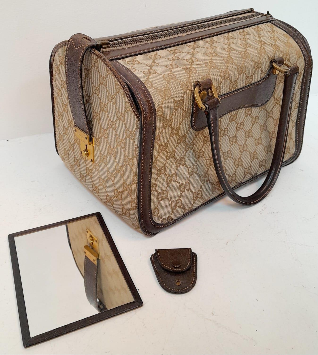 A Gucci Monogram Hard Train Vanity Case. Textile exterior with leather trim, two rolled leather - Image 2 of 7