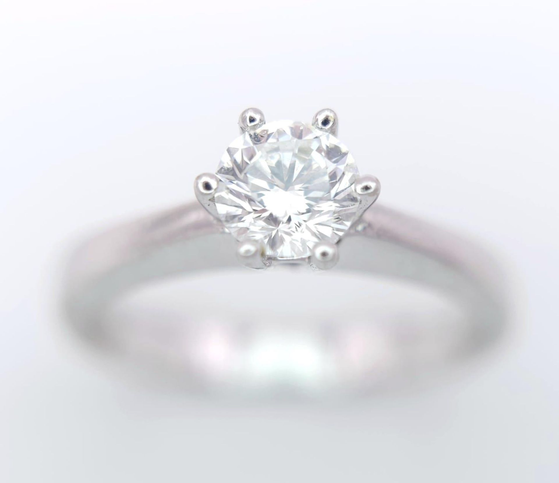 AN 18K WHITE GOLD DIAMOND SOLITAIRE RING - 0.50CT. 6 CLAW SETTING. 3.9G. SIZE N