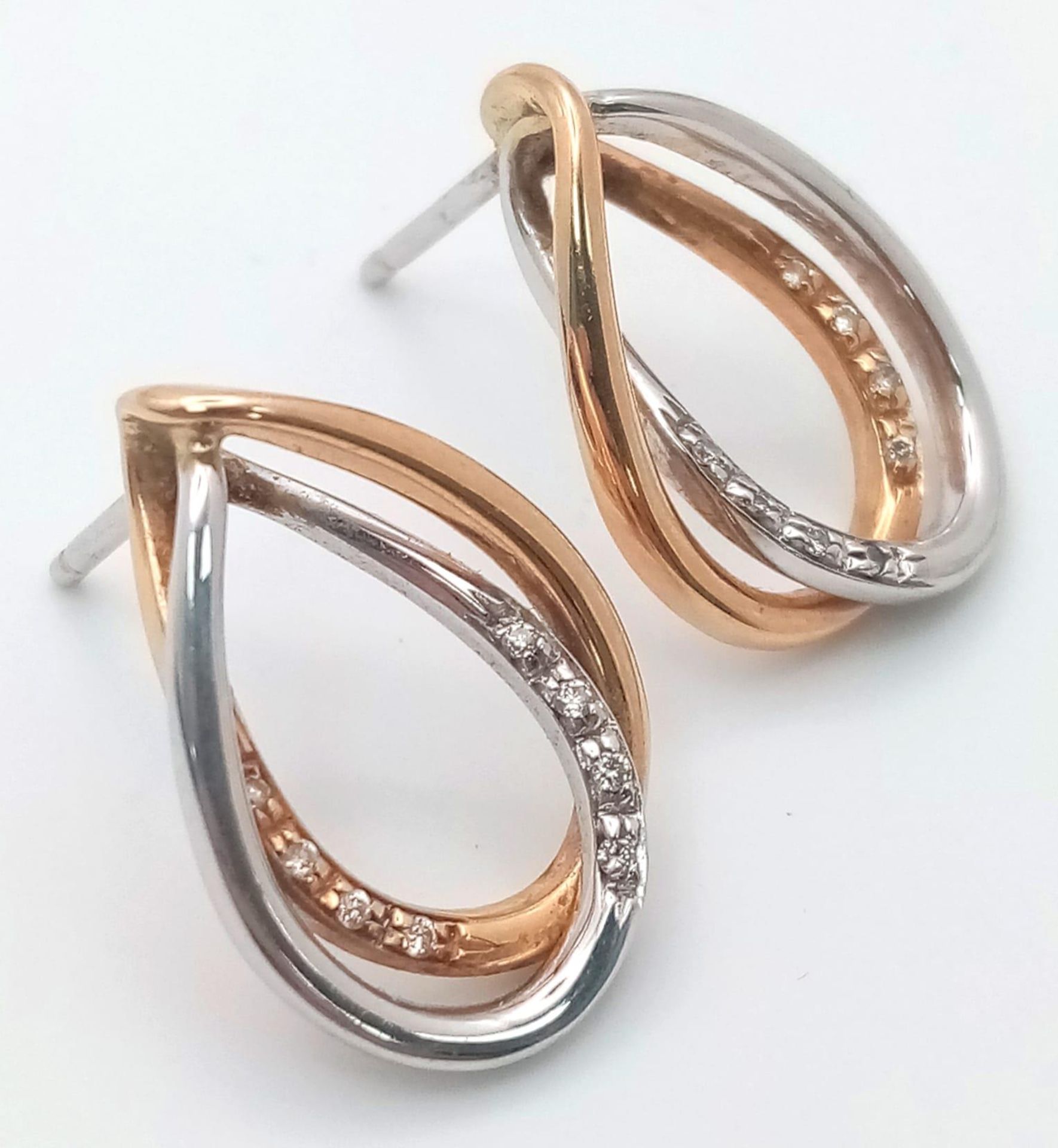 A Pair of 18K 2 Colour Diamond Set Drop Stud Earrings. Need butterfly backs. 2.1cm length, 6g