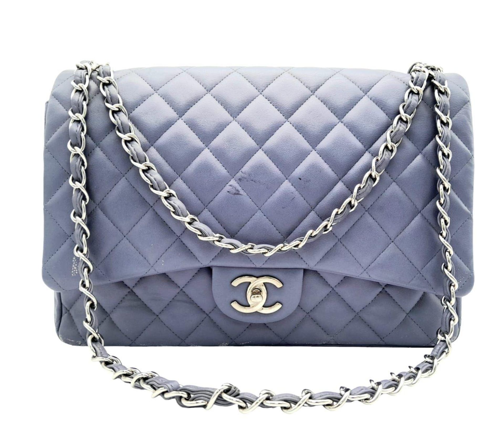 A Chanel Jumbo Double Flap Maxi Bag. Blue quilted caviar leather exterior with a large slip pocket