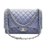 A Chanel Jumbo Double Flap Maxi Bag. Blue quilted caviar leather exterior with a large slip pocket