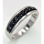 A 925 Silver and Sapphire Half Eternity Ring. Size X.