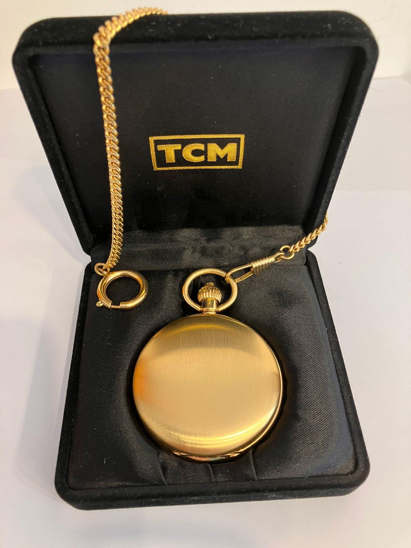 TCM SKELETON POCKET WATCH and CHAIN. Gold Plated. Manual winding/automatic movement. Skeleton