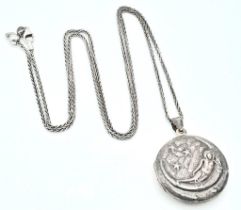 A vintage 925 silver locket pendant on silver chain. Total weight 16.16G. Total length 67cm.