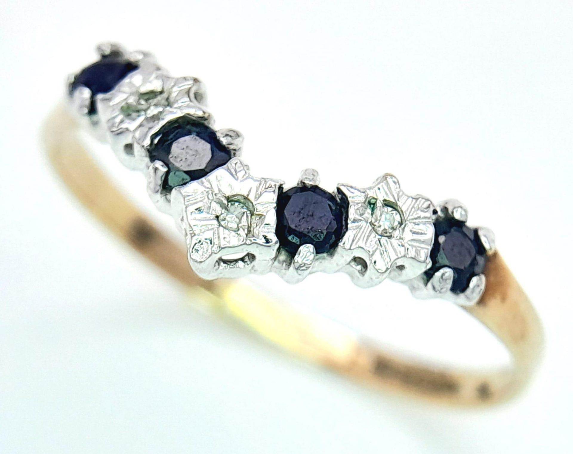 A Vintage 9K Yellow Gold Sapphire and Diamond Chevron Ring. Size N. 1g total weight.