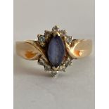 Impressive 14 carat YELLOW GOLD & DIAMOND RING, Having a Blue Bagette to centre with Diamonds