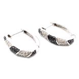 A Pair of 9K White Gold, Black & White Diamond Set Earrings. 0.40ctw, 2cm length, 5g total weight.