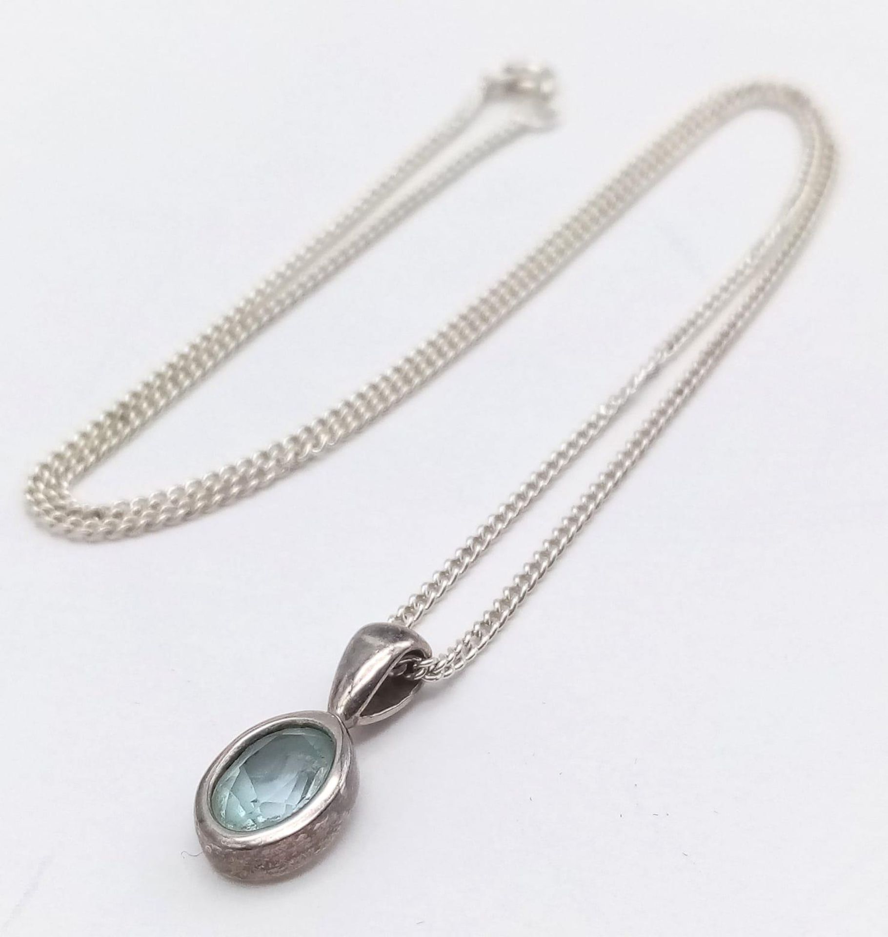 A Sterling Silver Blue Topaz Pendant on Chain. 1.8cm pendant, 46cm chain, 4.7g total weight. Ref: SC - Image 5 of 11