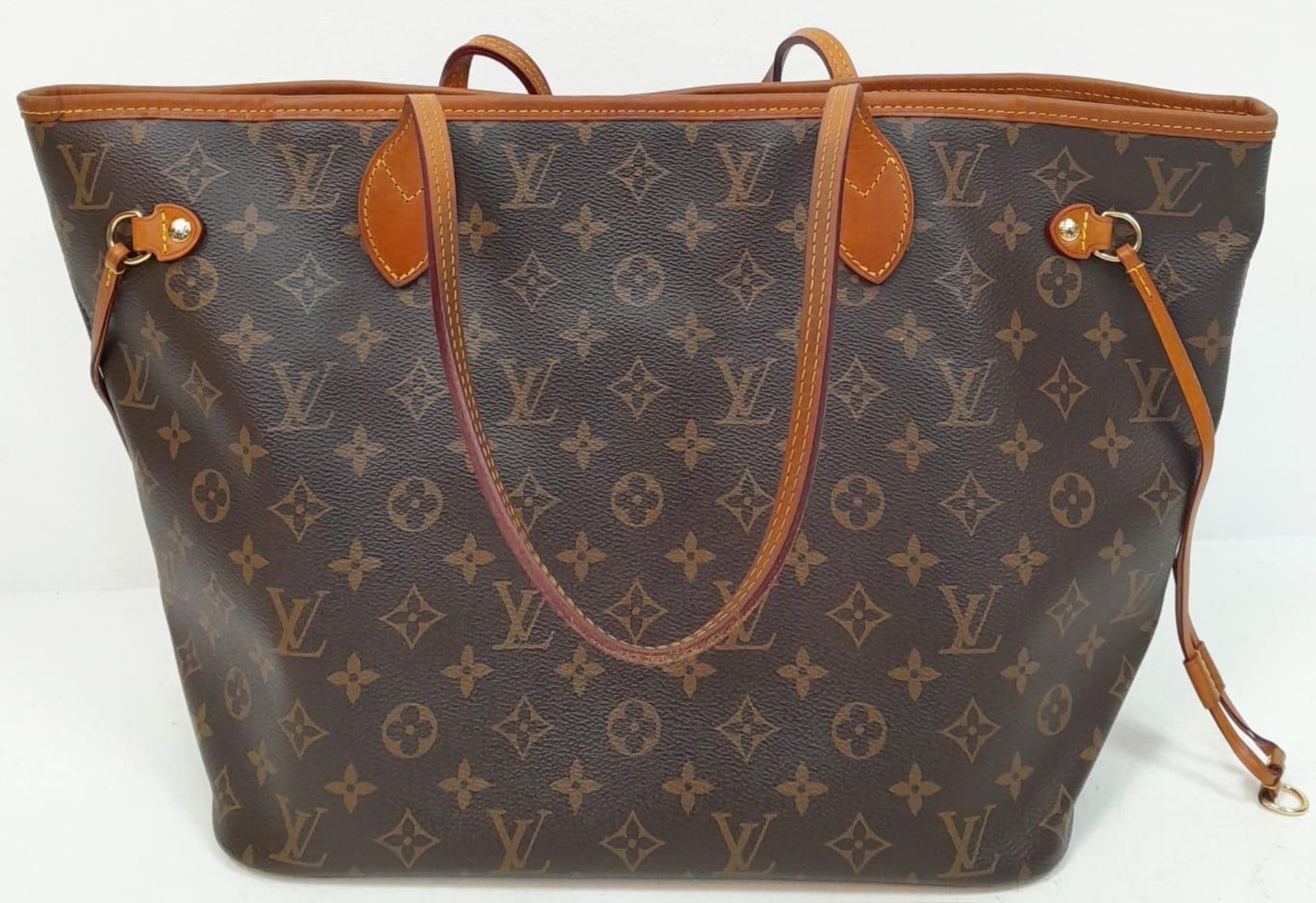 A Louis Vuitton Neverfull Tote Bag. LV monogram canvas exterior with cowhide handles and accents. - Bild 2 aus 5