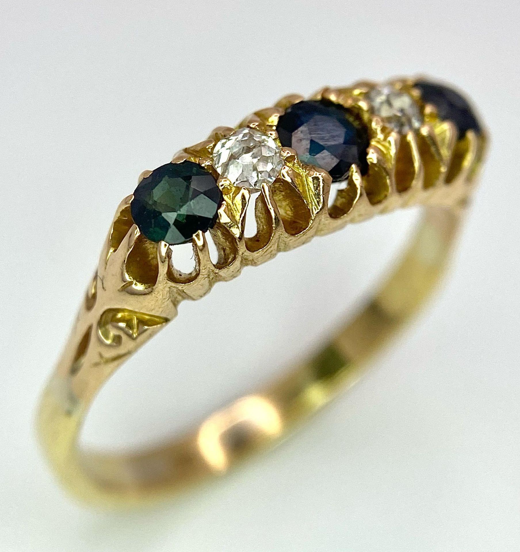 An 18K Yellow Gold Sapphire and Diamond Ring. Size Q. 3.9g