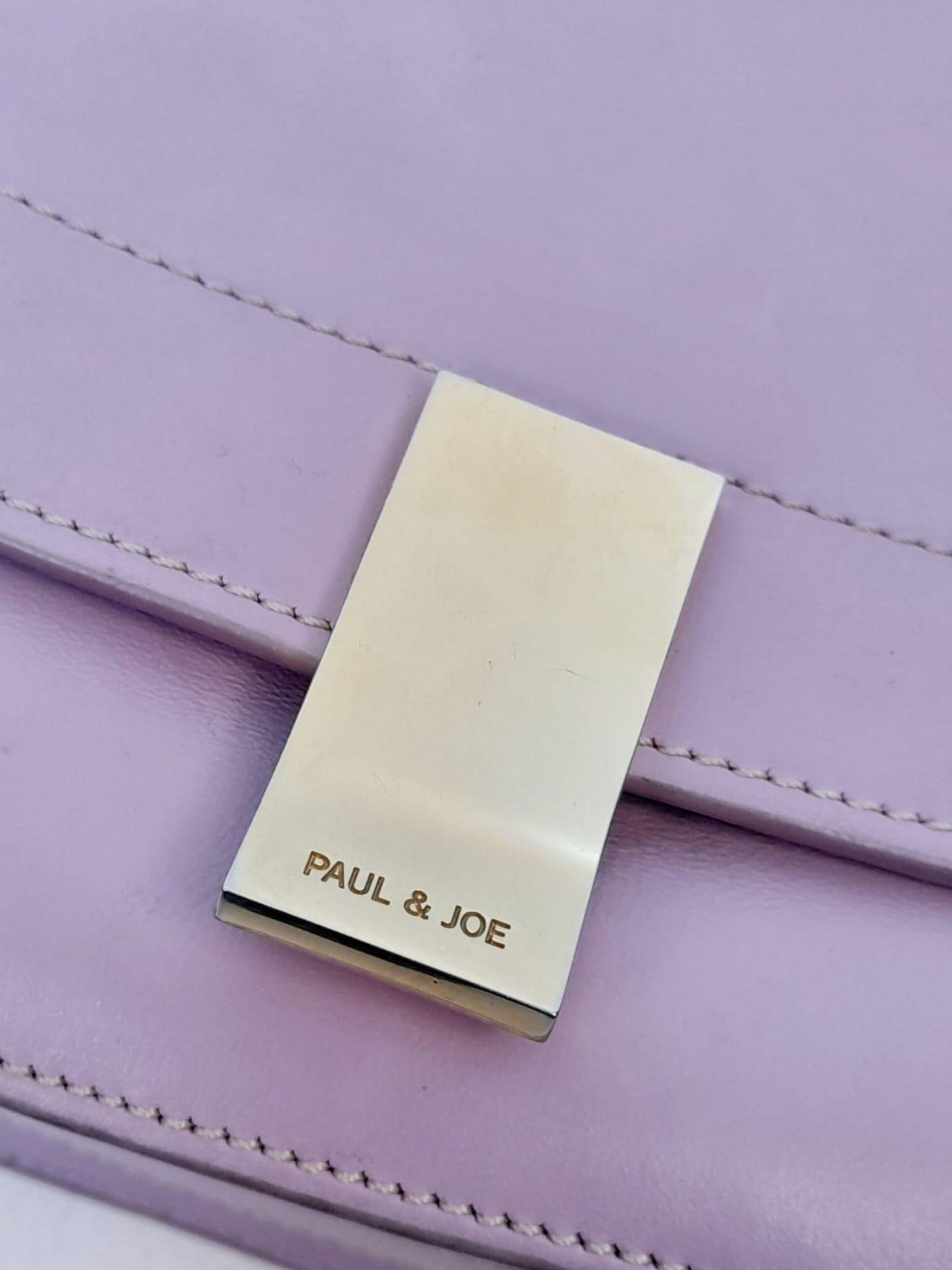 A Paul & Joe Lilac Saddle Bag. Leather exterior with adjustable strap, open compartment on back, and - Image 3 of 6