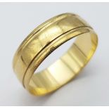 A Vintage 9K Yellow Gold Ridged Band Ring. 7mm width. Full UK hallmarks. 2.5g weight