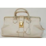 A Louis Vuitton Manhattan PM Suhali Leather Handbag. Soft white textured leather exterior with