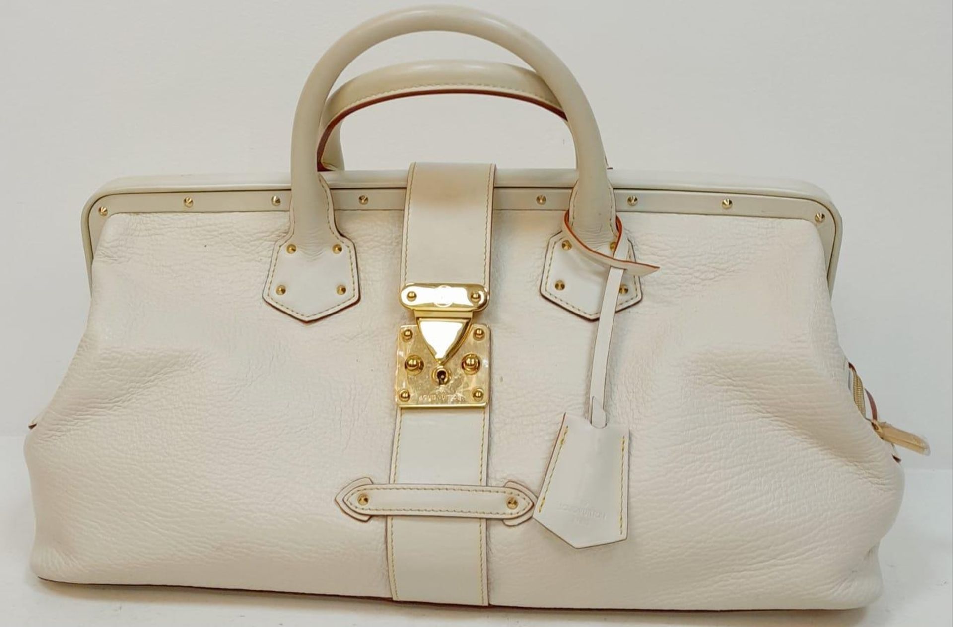 A Louis Vuitton Manhattan PM Suhali Leather Handbag. Soft white textured leather exterior with