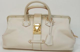 A Louis Vuitton Manhattan PM Suhali Leather Handbag. Soft white textured leather exterior with