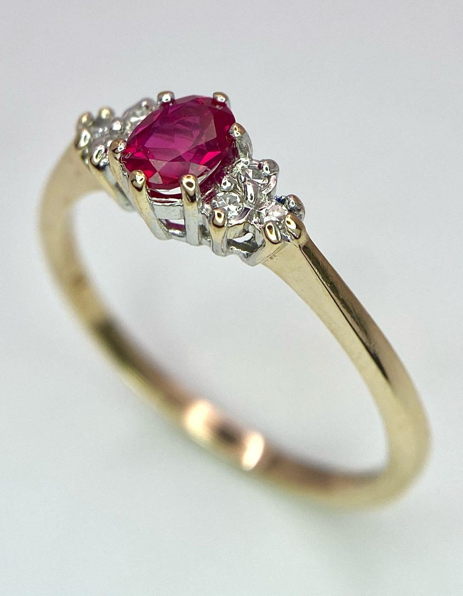 A 9K Yellow Gold Diamond & Red Stone (probably ruby) Ring. Size S, 2g total weight. Ref: 8418