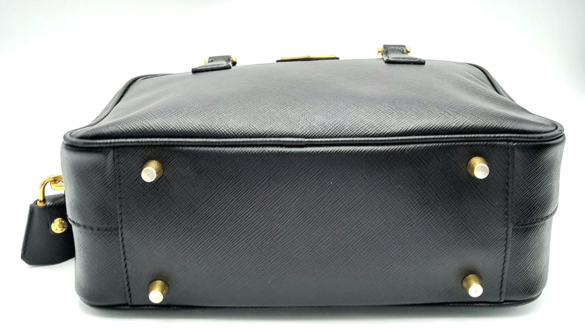 A Prada Black Bauletto Handbag. Saffiano leather exterior with gold-toned hardware, padlock, 2 - Image 5 of 11