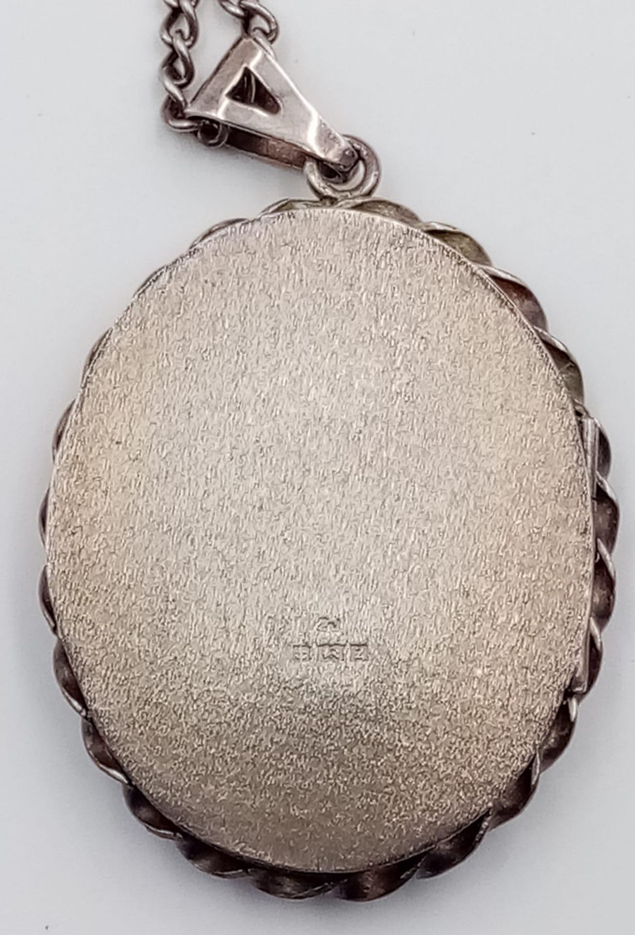 A vintage sterling silver floral motif locket pendant on silver chain. Full Birmingham hallmarks, - Image 5 of 6