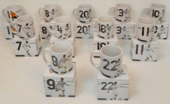 A Collection of Eleven Real Madrid Mugs - Each decorated with a different player. As new, in