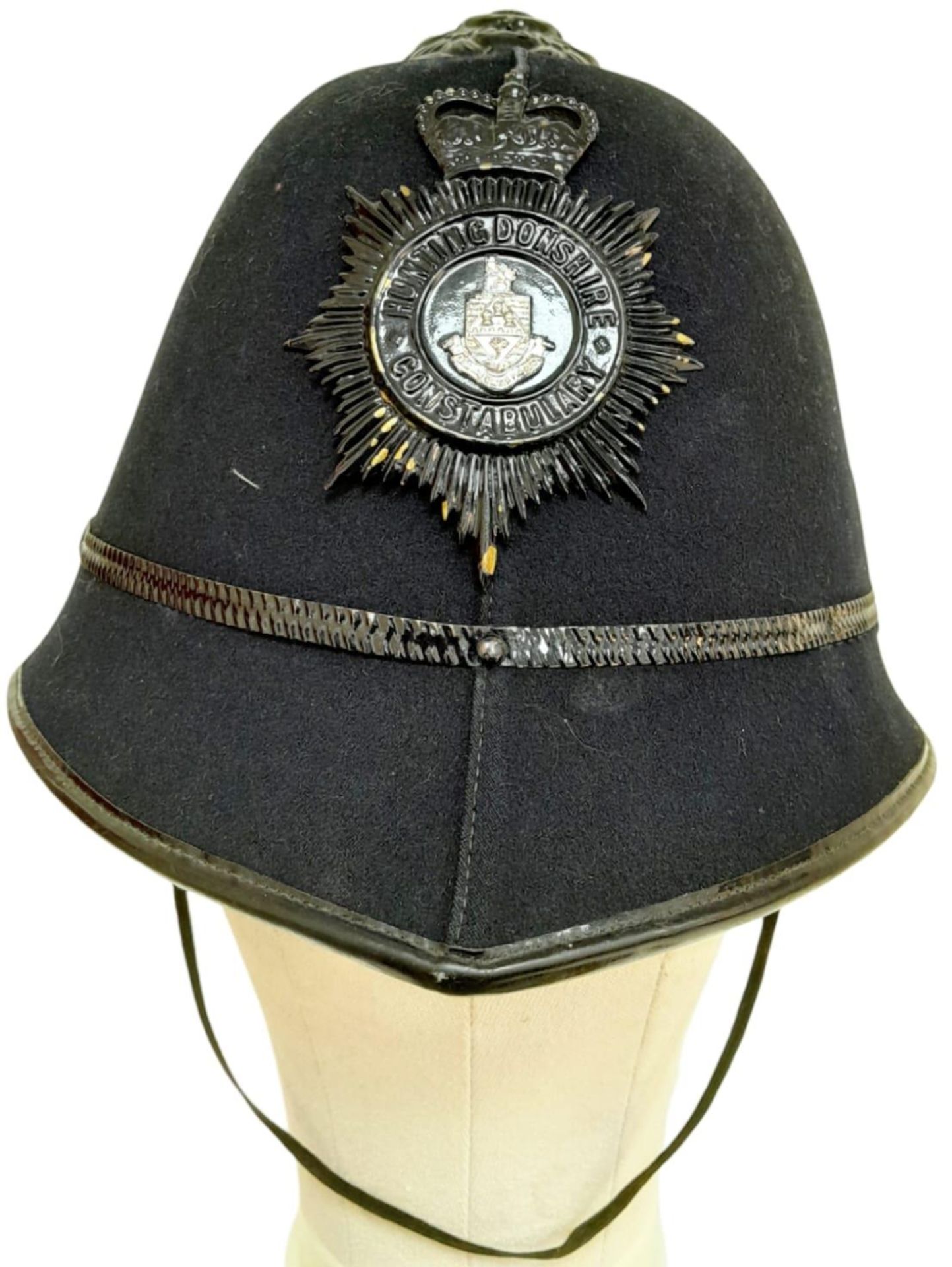 A Vintage Huntingdon Constabulary Police Helmet. Original badge.