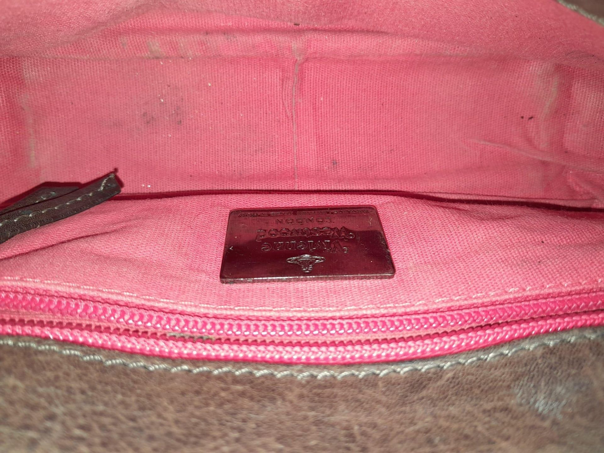 A Vintage Vivienne Westwood Handbag. Brown leather and pony hair exterior. Key clasp. Red textile - Image 6 of 8