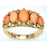 A 9K YELLOW GOLD CORAL 5 STONE RING. 4G. SIZE O.
