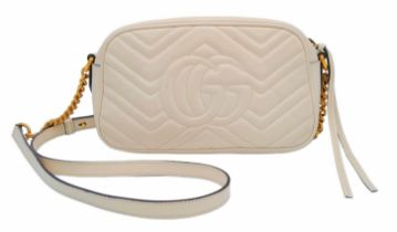 A Gucci Ivory GG Marmont Cross Body Bag. Quilted leather exterior with gold-toned hardware, chain