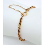 A 9K Yellow Gold Rope Bracelet with Safety Chain. 17.5cm length, 2.5g weight. Ref: SC 7070