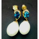 A Pair of White Pearl and London Blue Topaz 9K Gold Drop Earrings. 3.6g total weight.