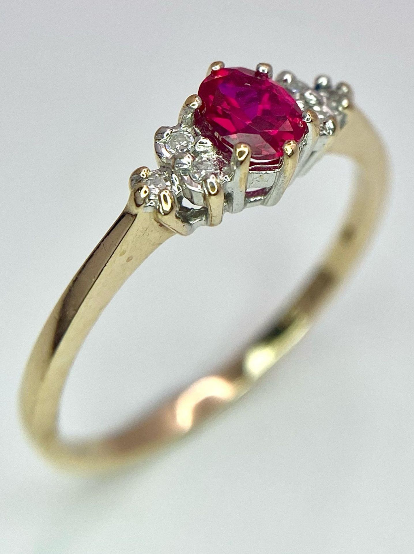 A 9K Yellow Gold Diamond & Red Stone (probably ruby) Ring. Size S, 2g total weight. Ref: 8418 - Image 3 of 7