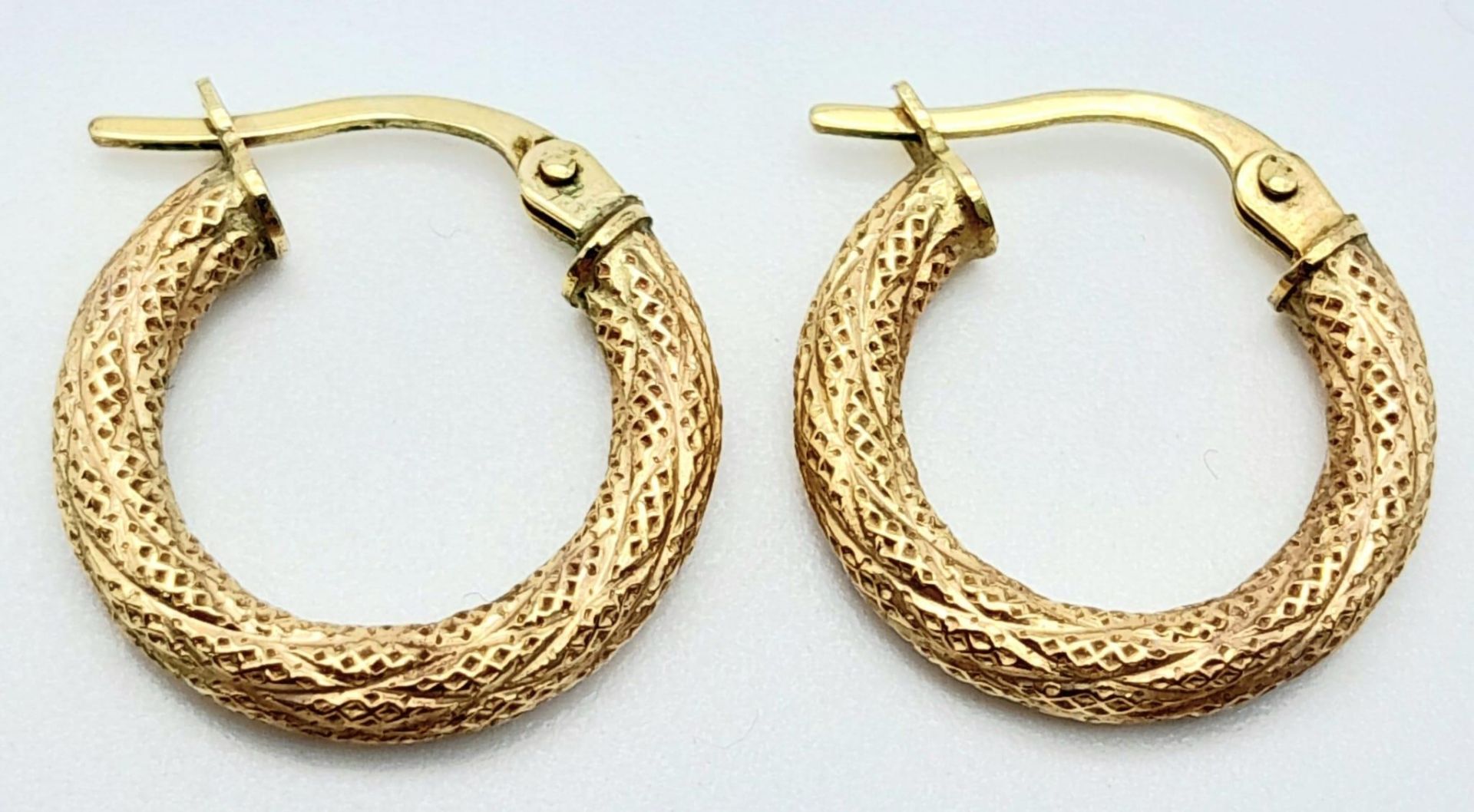 A Pair of 9K Yellow Gold Small Creole Earrings. 1.2g weight.