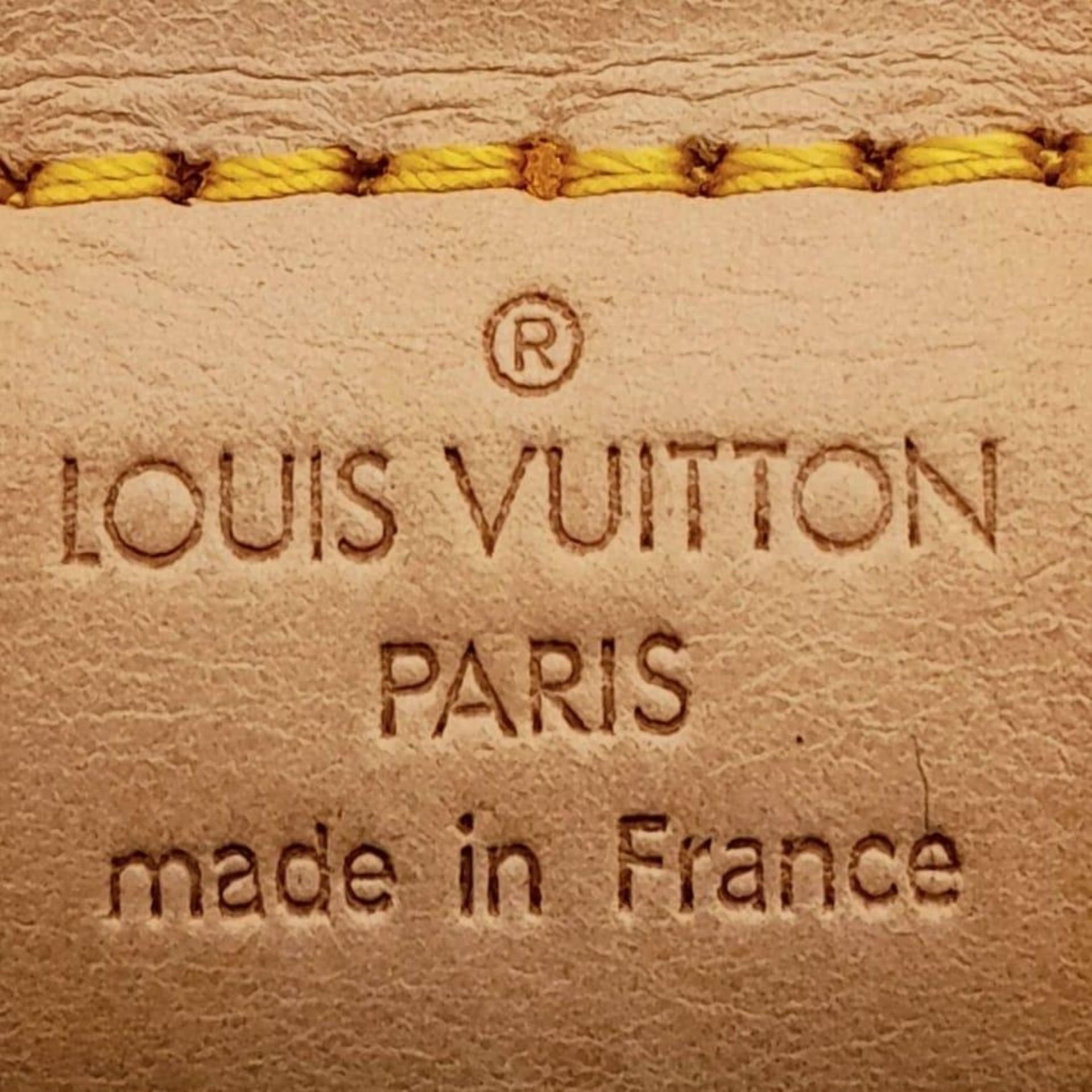 A Louis Vuitton Monogram Keepall 60 Travel Bag. Leather exterior with gold-toned hardware, two - Image 11 of 12