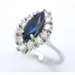 AN 18K WHITE GOLD DIAMOND & SAPPHIRE MARQUISE SHAPE RING. 0.40CTW OF DIAMONDS AND A 1.20CT