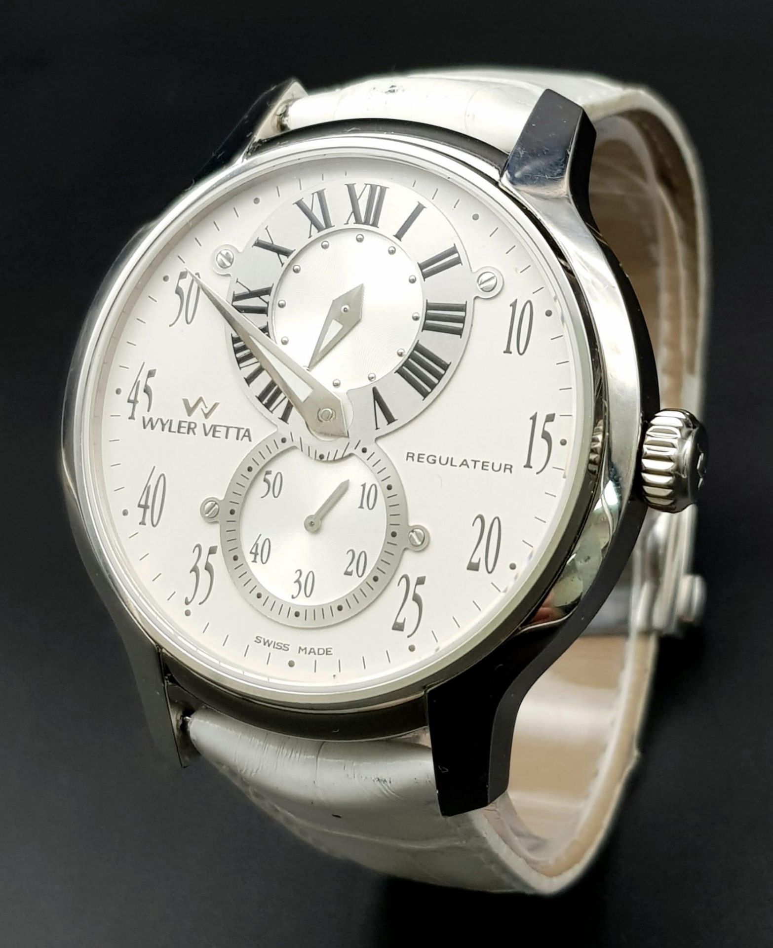 A Wyler Vetta Regulateur Quartz Gents Watch. White leather strap. Stainless steel case - 44mm. White