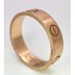 A Cartier 18K Rose Gold Love Band Gents Ring. 6mm width. Cartier hallmarks. Size W. 8.6g weight.