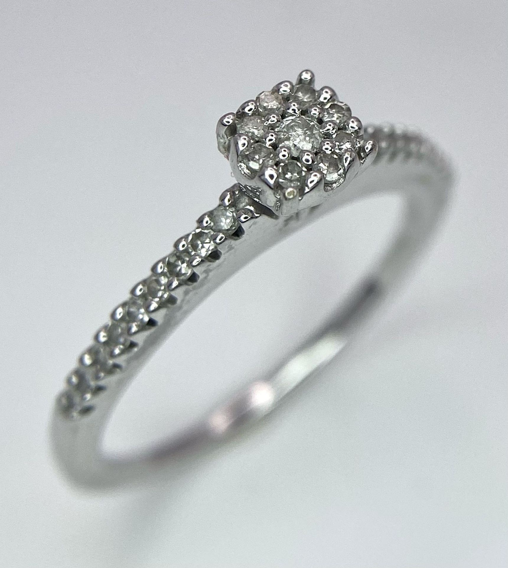 A 9K White Gold Diamond Cluster Ring. 0.15ctw, size L, 2g total weight. Ref: 8411