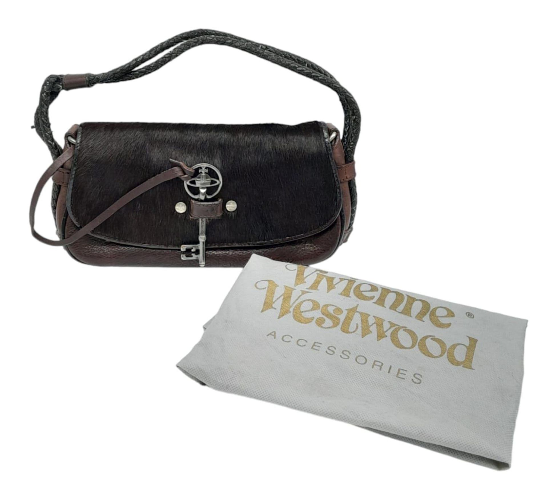 A Vintage Vivienne Westwood Handbag. Brown leather and pony hair exterior. Key clasp. Red textile - Image 5 of 8