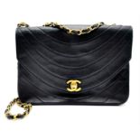A Chanel (Coco Mark) Lambskin Single Flap Double Chain Bag. Gold tone hardware including CC clasp.
