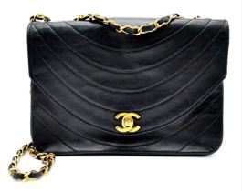 A Chanel (Coco Mark) Lambskin Single Flap Double Chain Bag. Gold tone hardware including CC clasp.