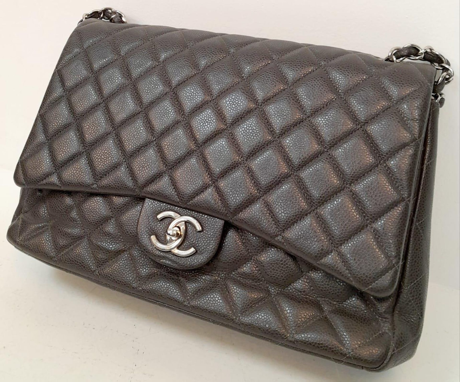 A Chanel Jumbo Double Flap Maxi Bag. Dark grey quilted caviar leather exterior with a large slip - Image 3 of 12