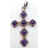 A Sterling Silver Amethyst Cabochon Cross Pendant. 4.5cm Length. Set with 4mm Round Cut Amethyst